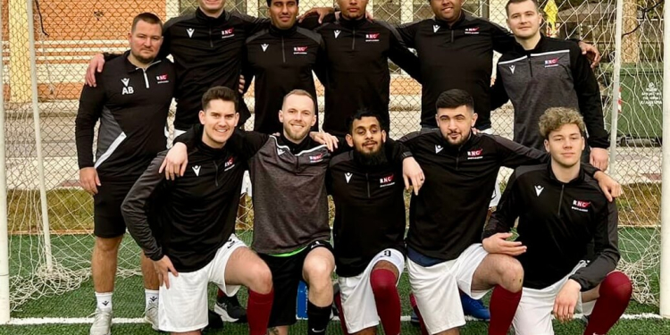 UK blind football team line up for a team photo