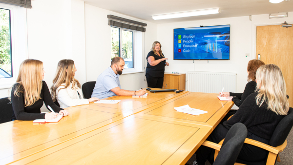 The Dawleys team going through their culture during a meeting